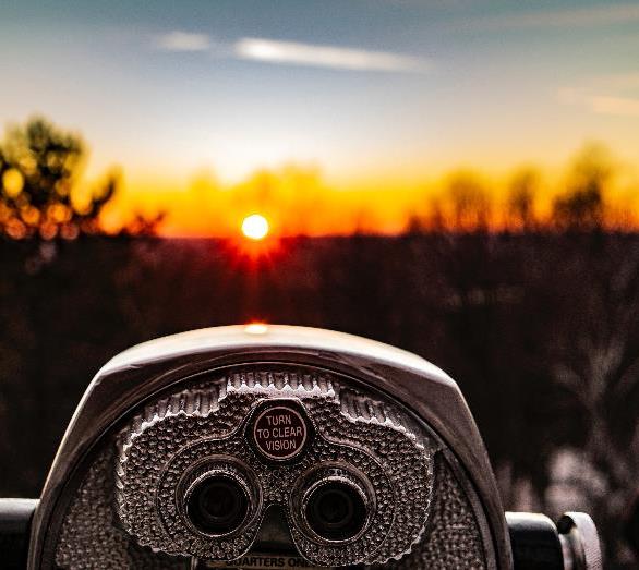 A view through a telescope at sunset